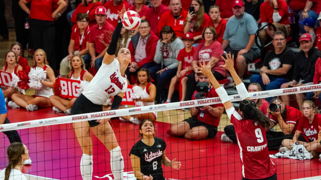 Oct 21, 2023; Lincoln, NE, USA; Nebraska Cornhuskers outside hitter Merritt Beason (13) attacks against Wisconsin Badgers middle blocker Caroline Crawford (9) during the fifth set at the Bob Devaney Sports Center. Mandatory Credit: Dylan Widger-USA TODAY Sports